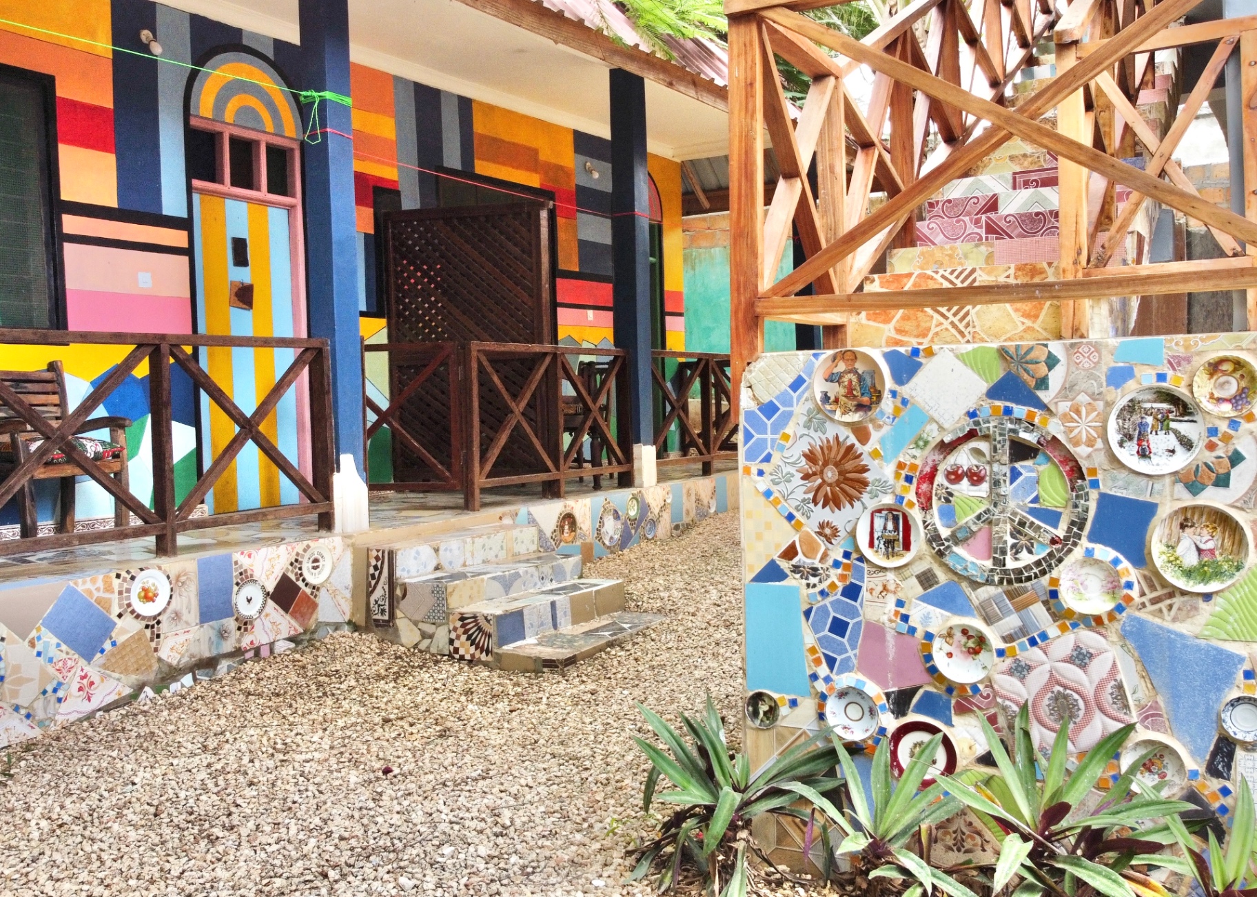 Vibrant painted bungalows with mosaic tile artwork